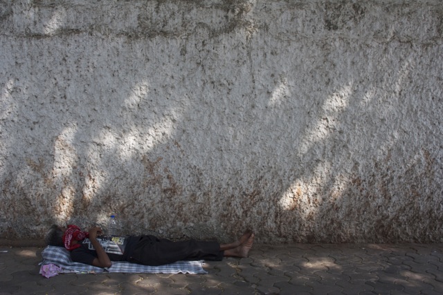 Man sleeping in Mumbai Mumbai in Pictures - Photo Essay